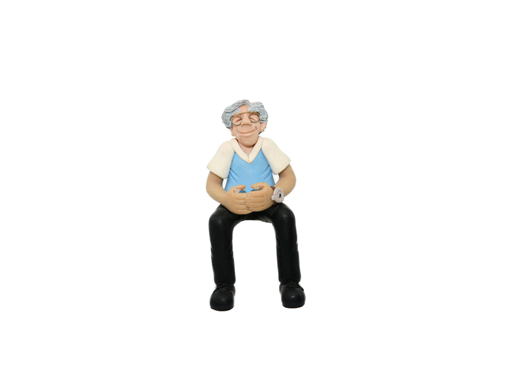 Man Sitting With Watch On-Figurine